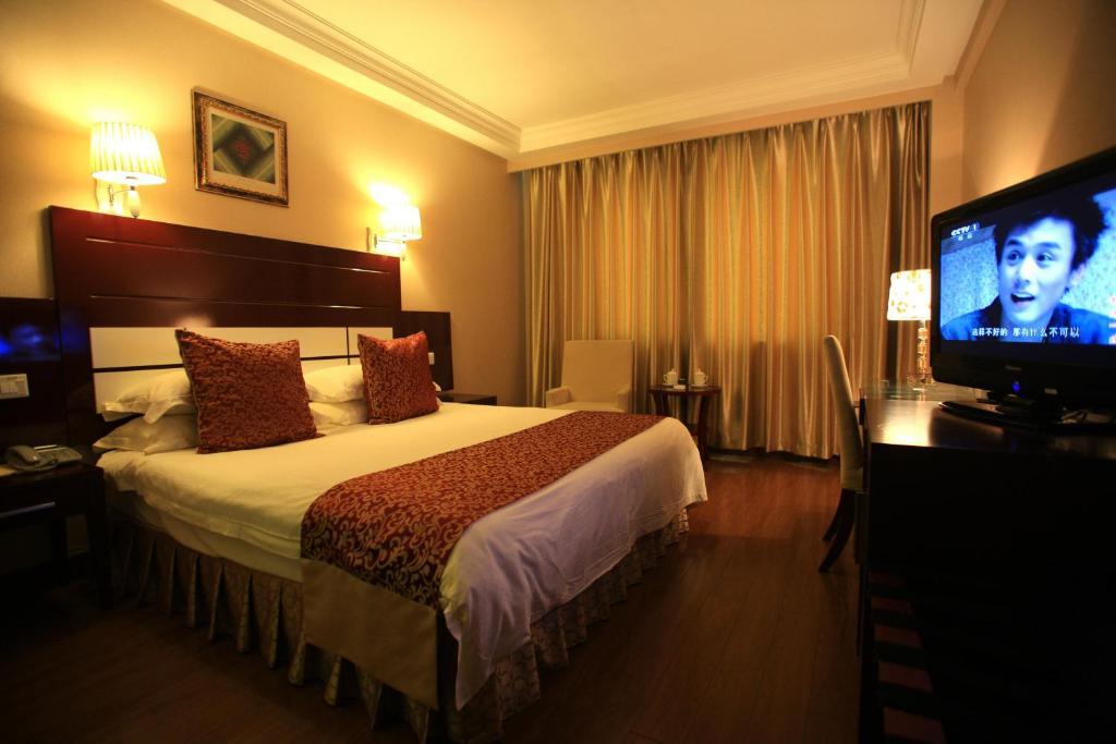 Overseas Chinese International Hotel Qingdao Quarto foto