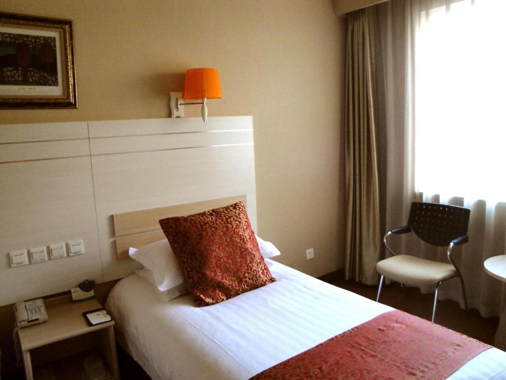 Overseas Chinese International Hotel Qingdao Quarto foto