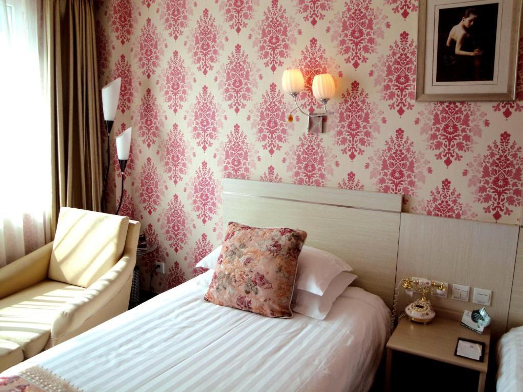 Overseas Chinese International Hotel Qingdao Quarto foto